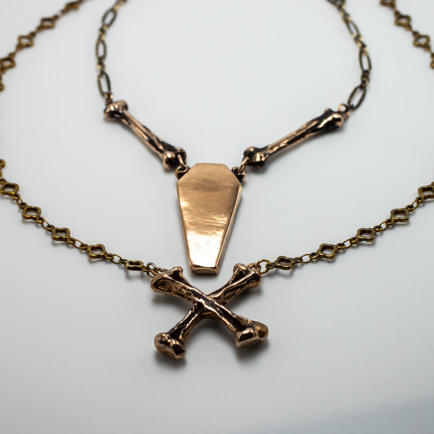 CROSSBONE IN BRONZE