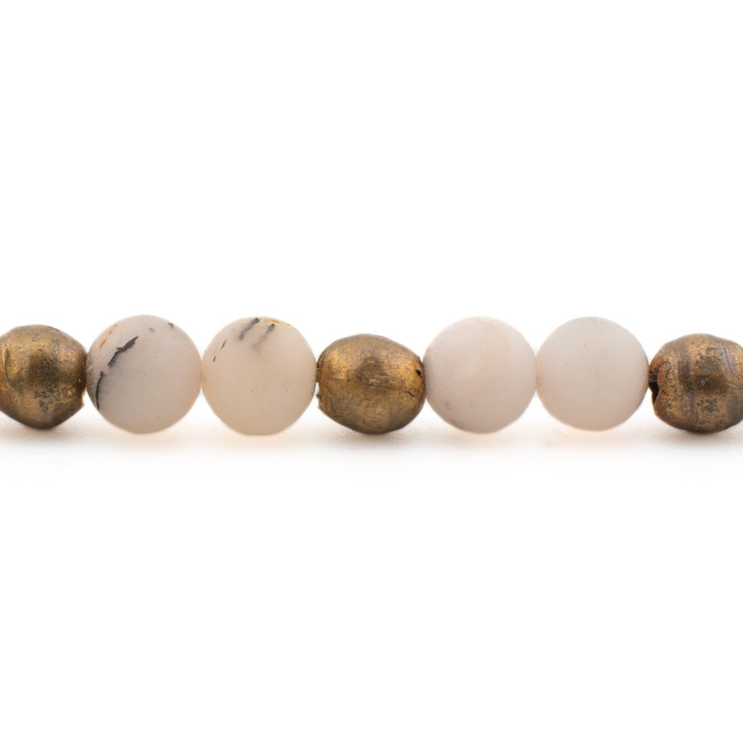 Up close detail of Pink Opal Yoga Bracelet with natural stone beads and brass hardware, handmade in Austin Texas, made in USA jewelry