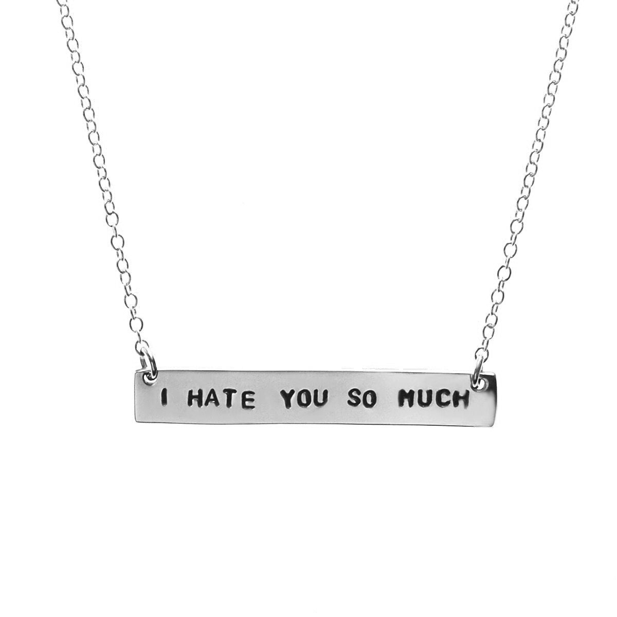 A silver chain necklace with the text 'I HATE YOU SO MUCH' stamped in capital letters.