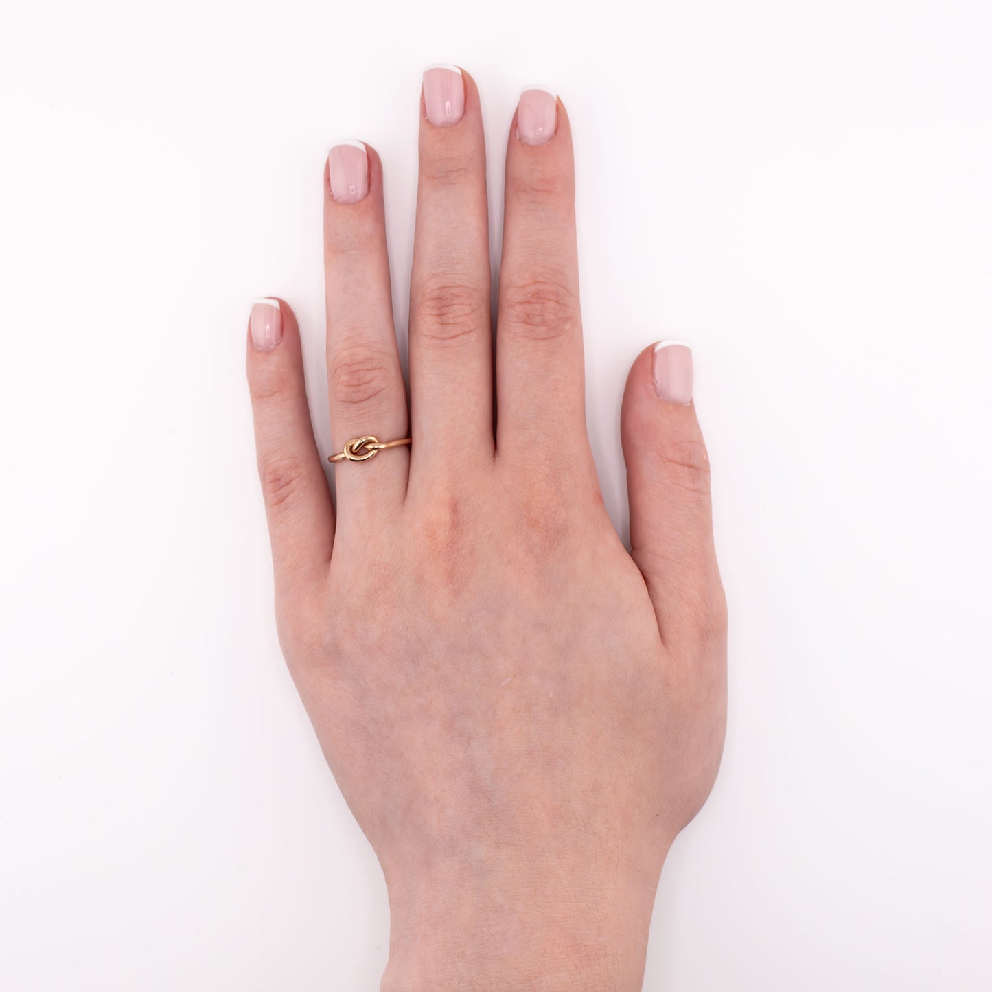 14k gold-filled Big Knot stacking ring worn on hand at overview angle, bold durable knot ring handmade for stacking or solo wear