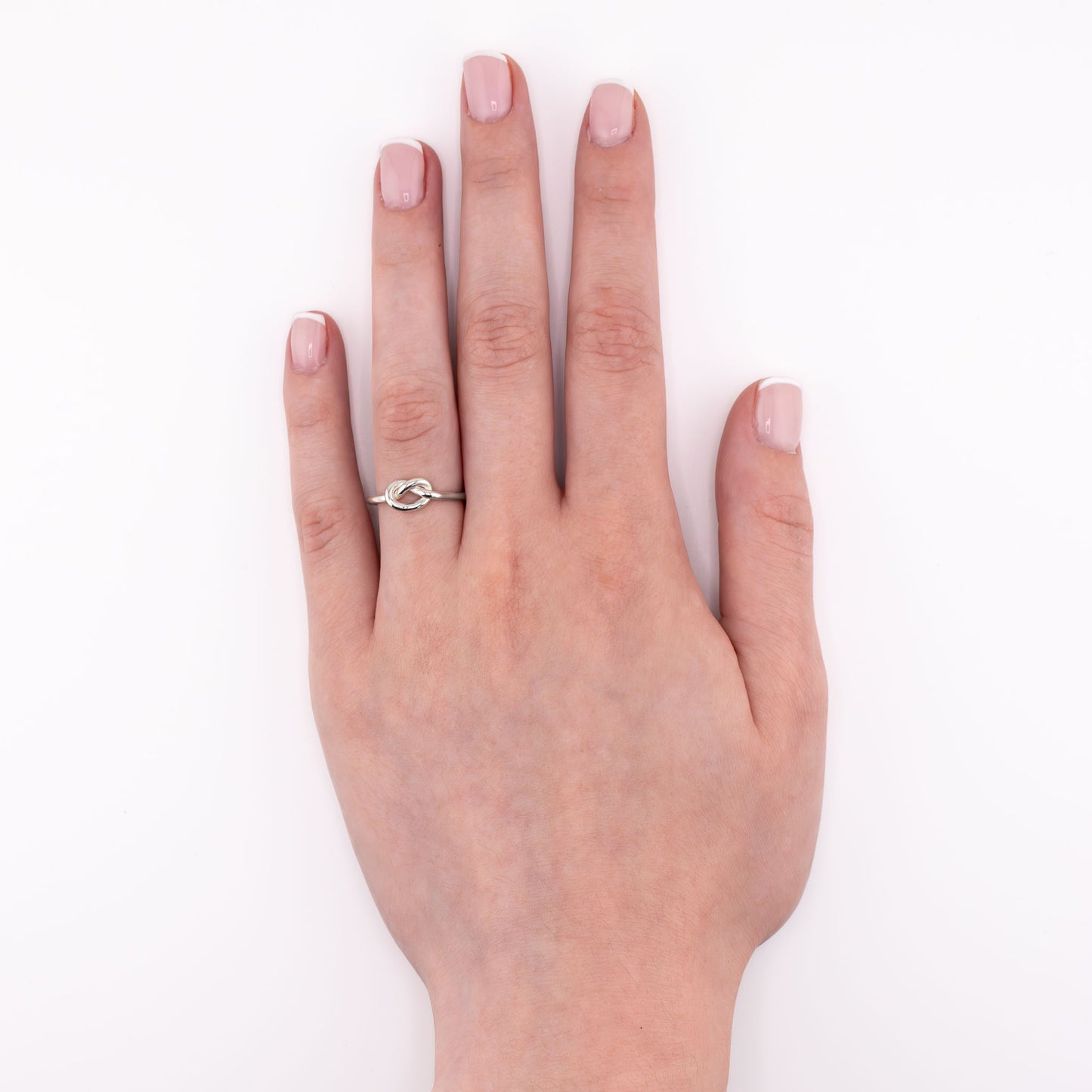 Sterling silver Big Knot stacking ring shown on hand at an overview angle, durable bold knot jewelry for everyday wear