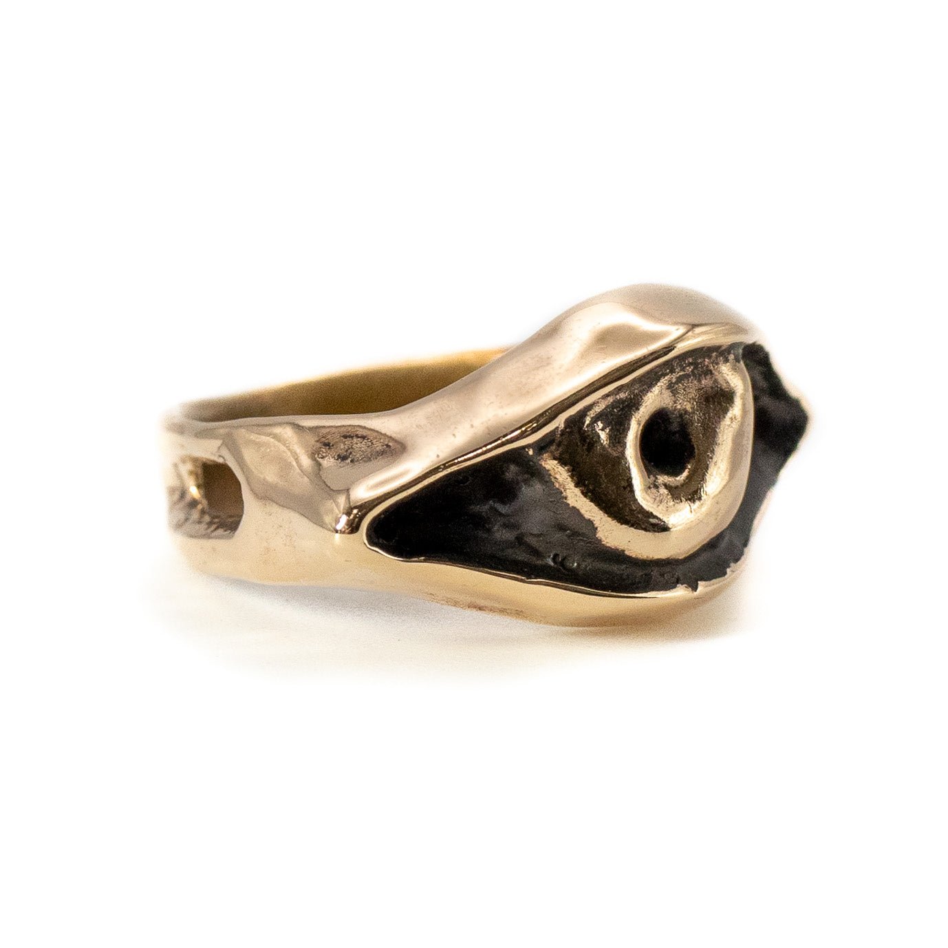 Cast bronze Evil Eye ring photographed at an angle, handmade talisman jewelry from Austin, Texas