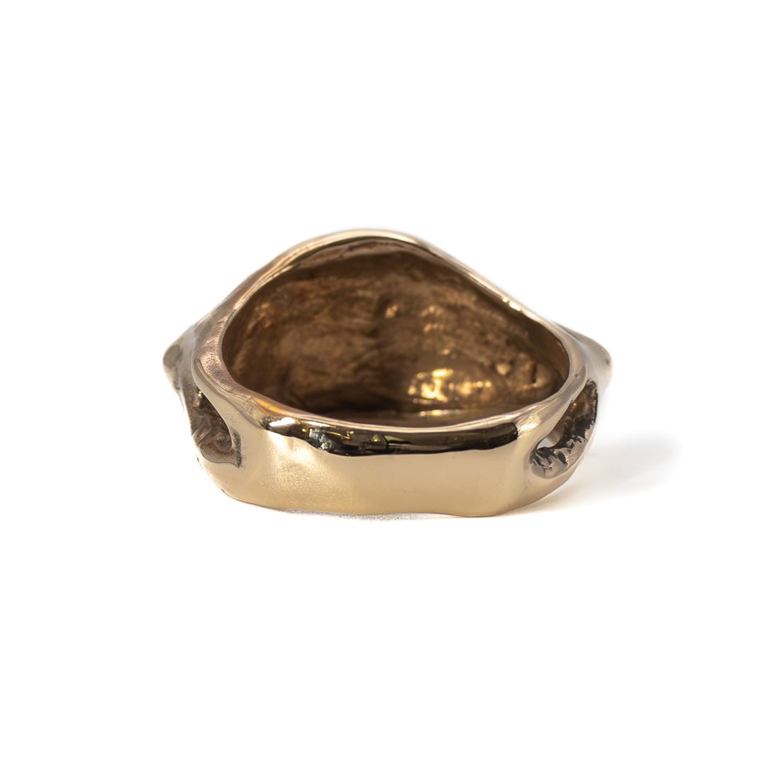Back view of cast bronze Evil Eye ring, handmade jewelry with organic sculpted finish