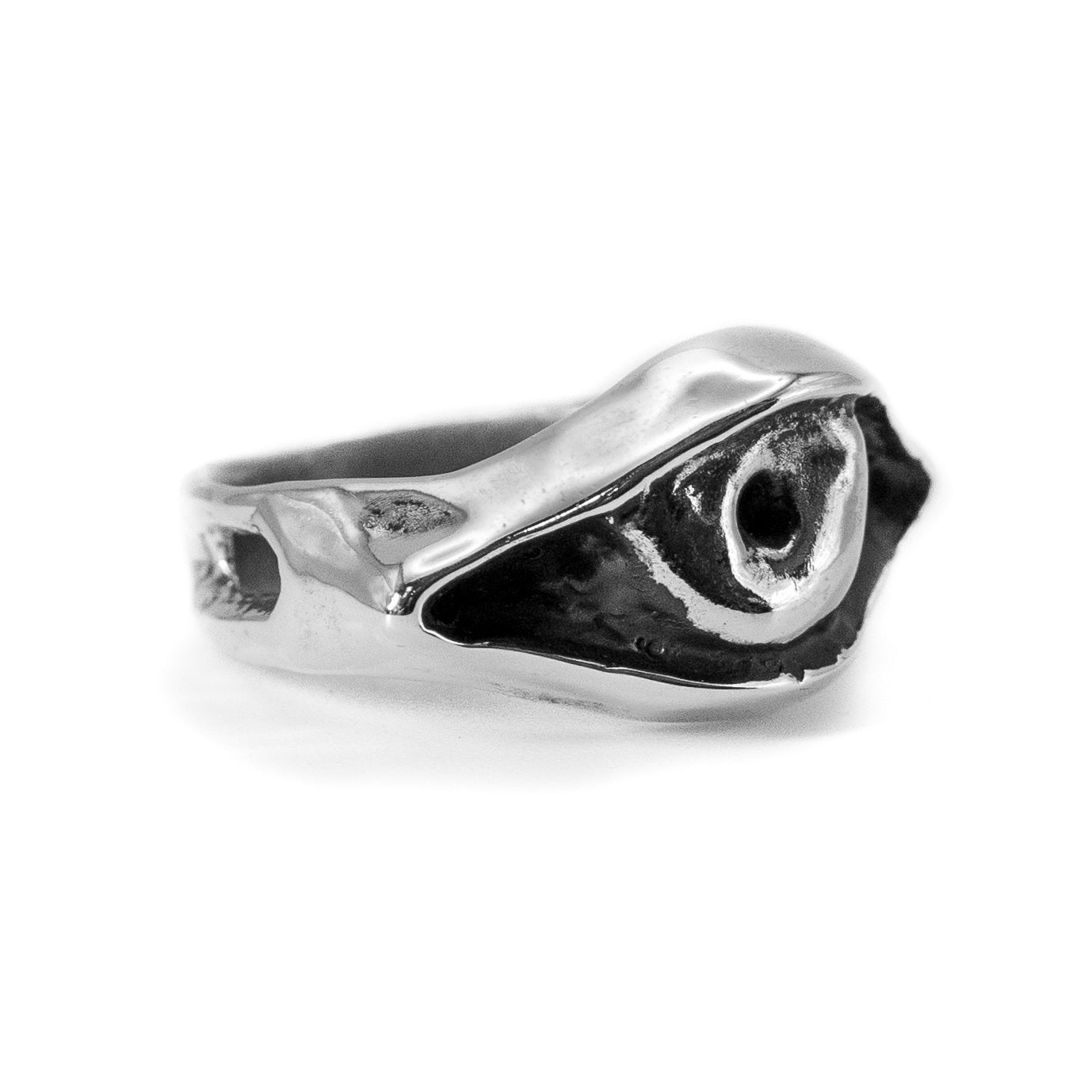 Cast silver Evil Eye ring photographed at an angle, handmade protective talisman jewelry