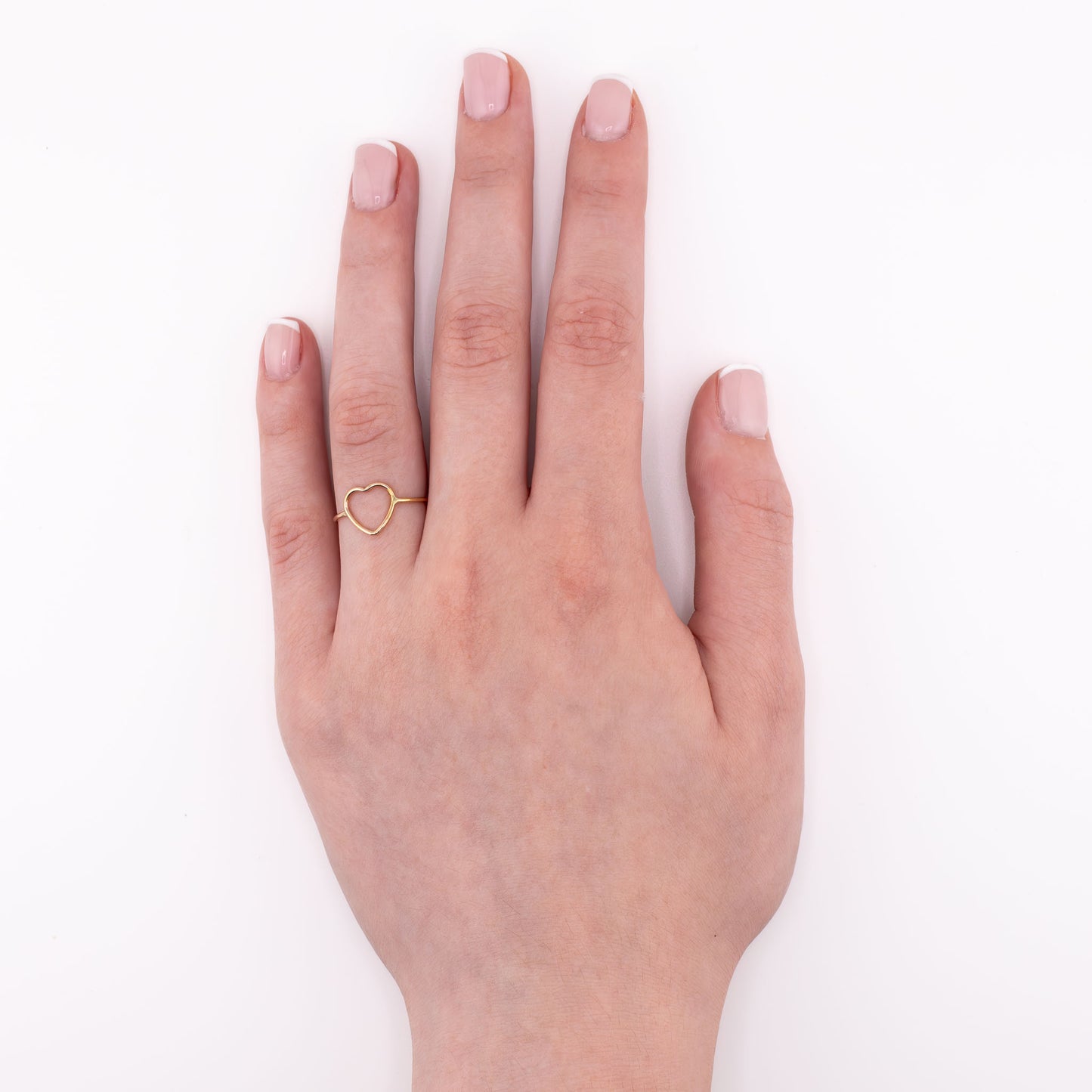 14k gold-filled Heart stacking ring on hand model, minimalist handmade love jewelry for stacking or solo wear