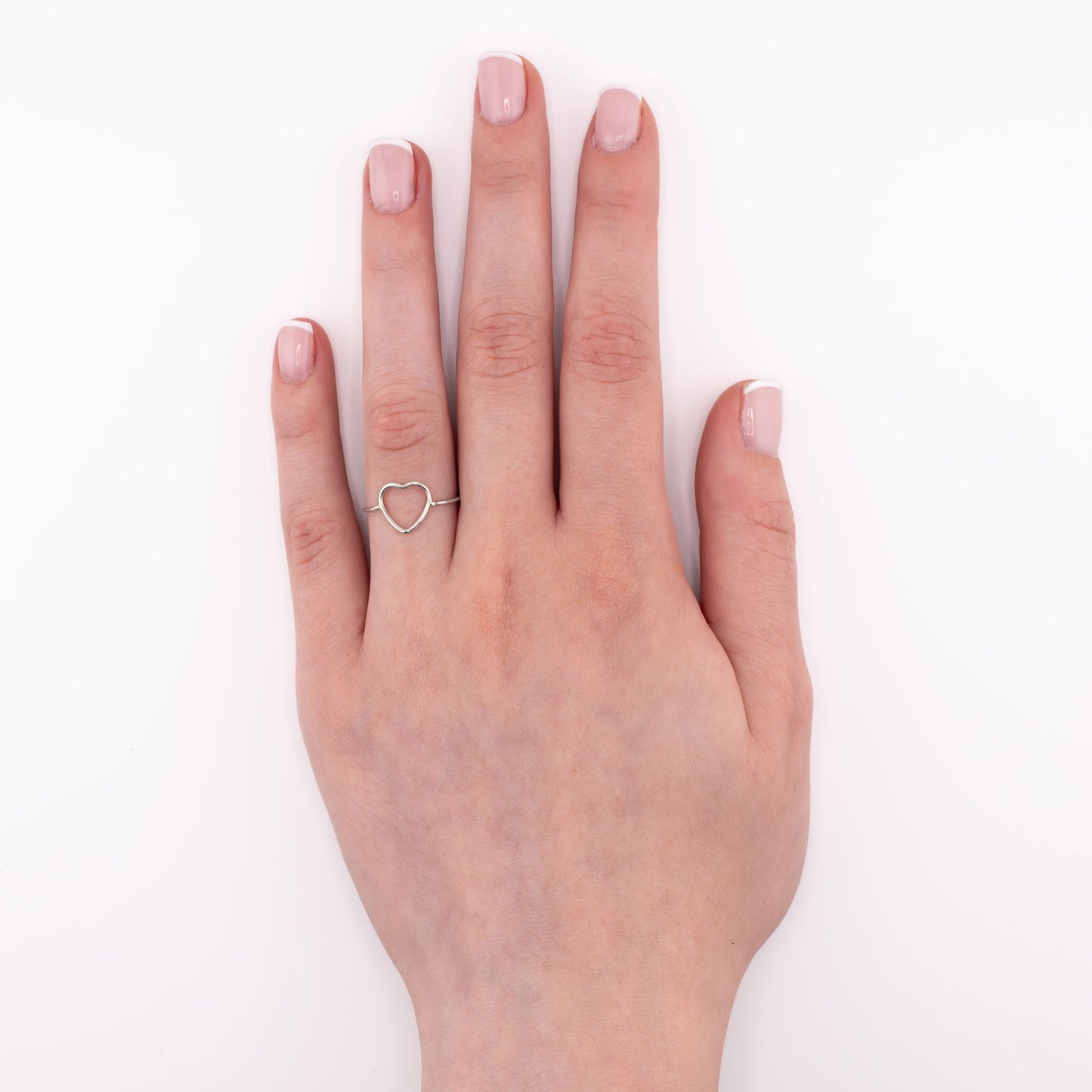 Sterling silver Heart stacking ring worn on hand, simple symbolic love ring for daily wear