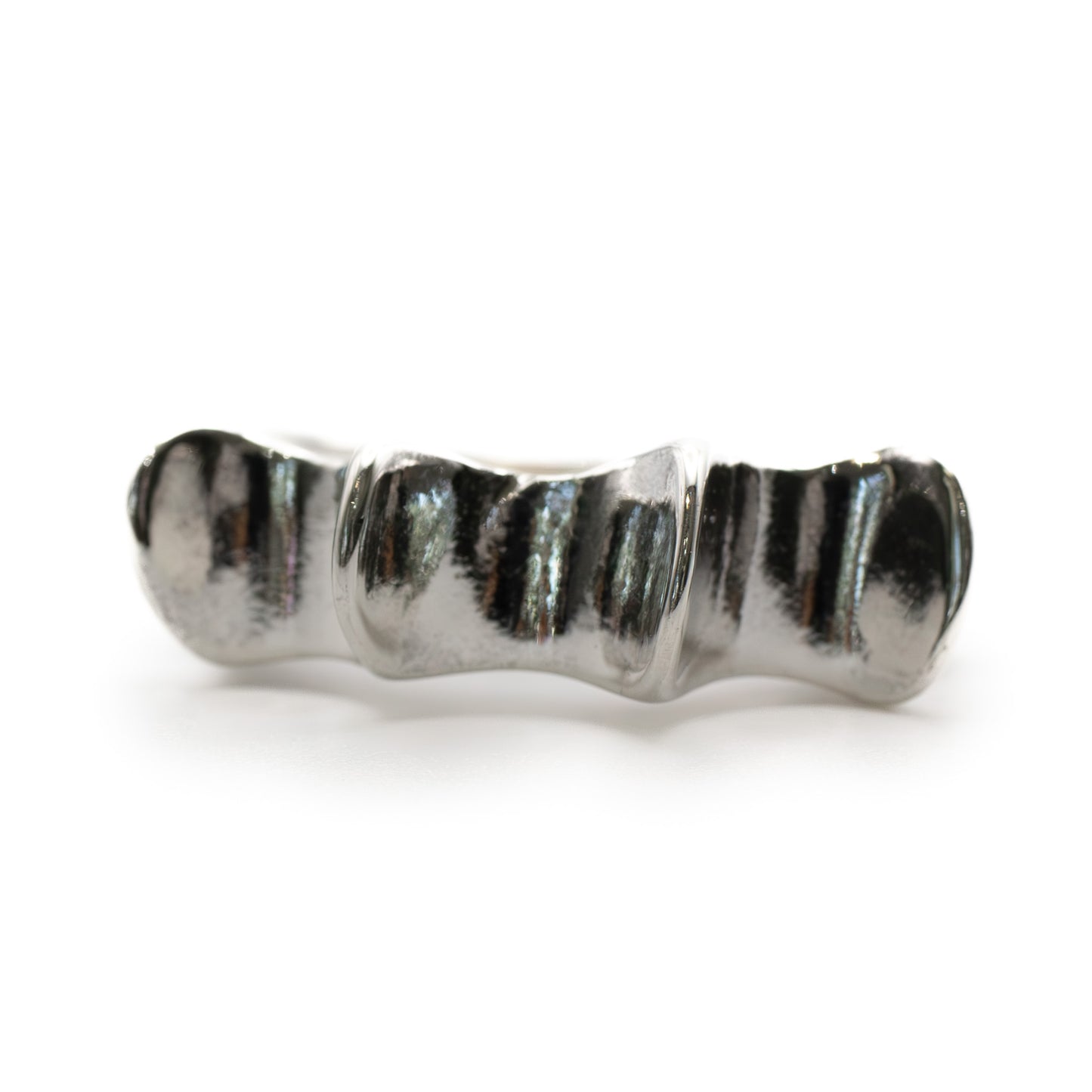 Close-up of Salacia Ring in sterling silver with textured wave design, Roman mythology inspired jewelry