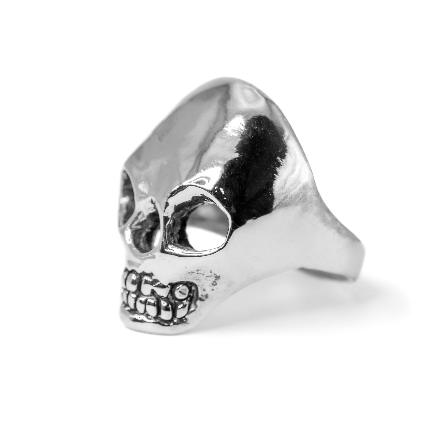 Close-up of sterling silver Skull Ring with polished design, handmade in Texas, USA