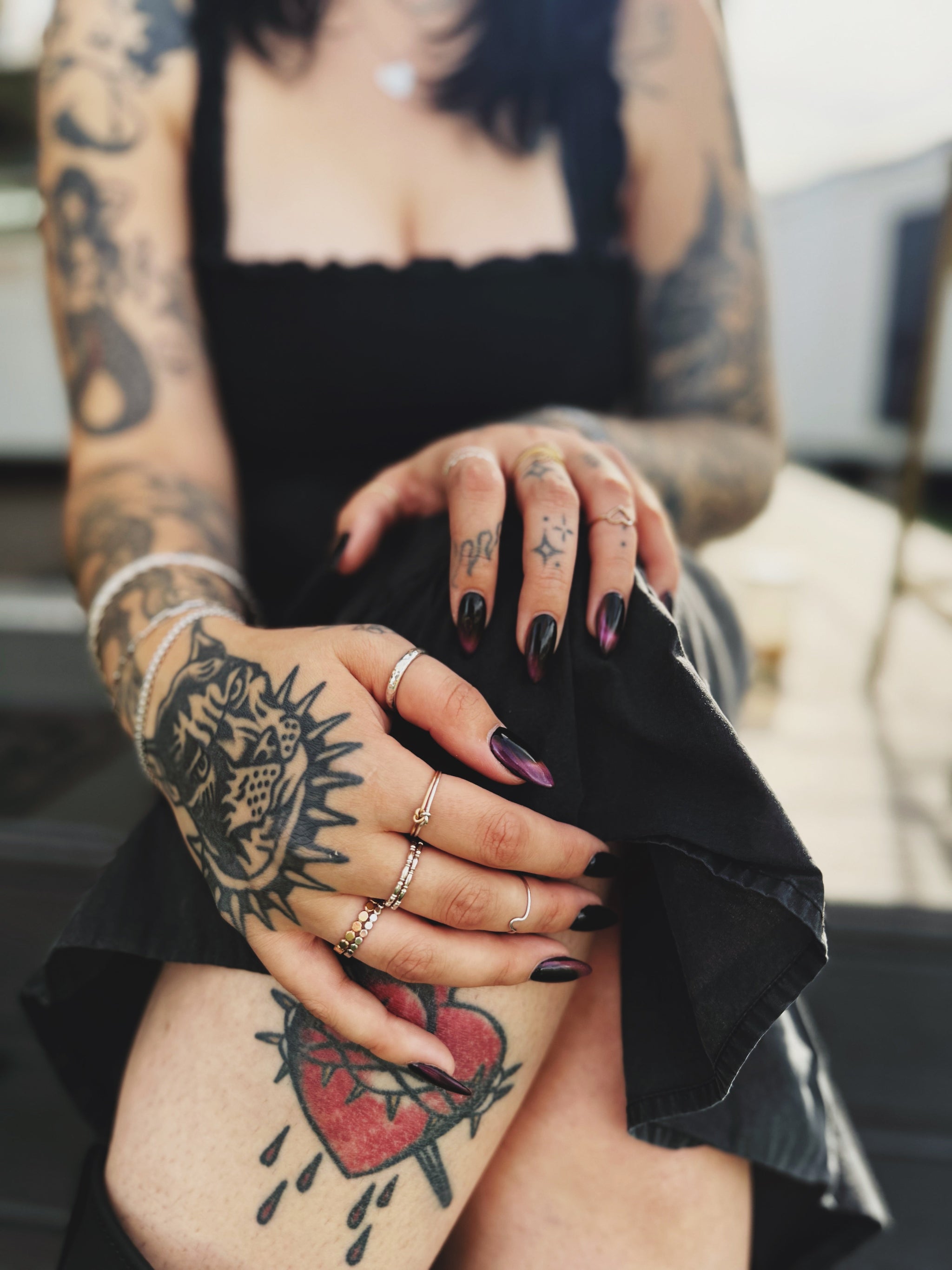 Lifestyle photo of woman on South Congress in Austin wearing House of Eberstein handmade jewelry, stacking rings, and permanent bracelet