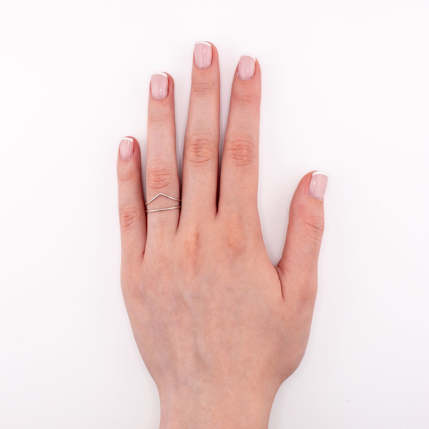Tiny Band and Chevron stacking rings layered together in sterling silver and 14k gold-filled