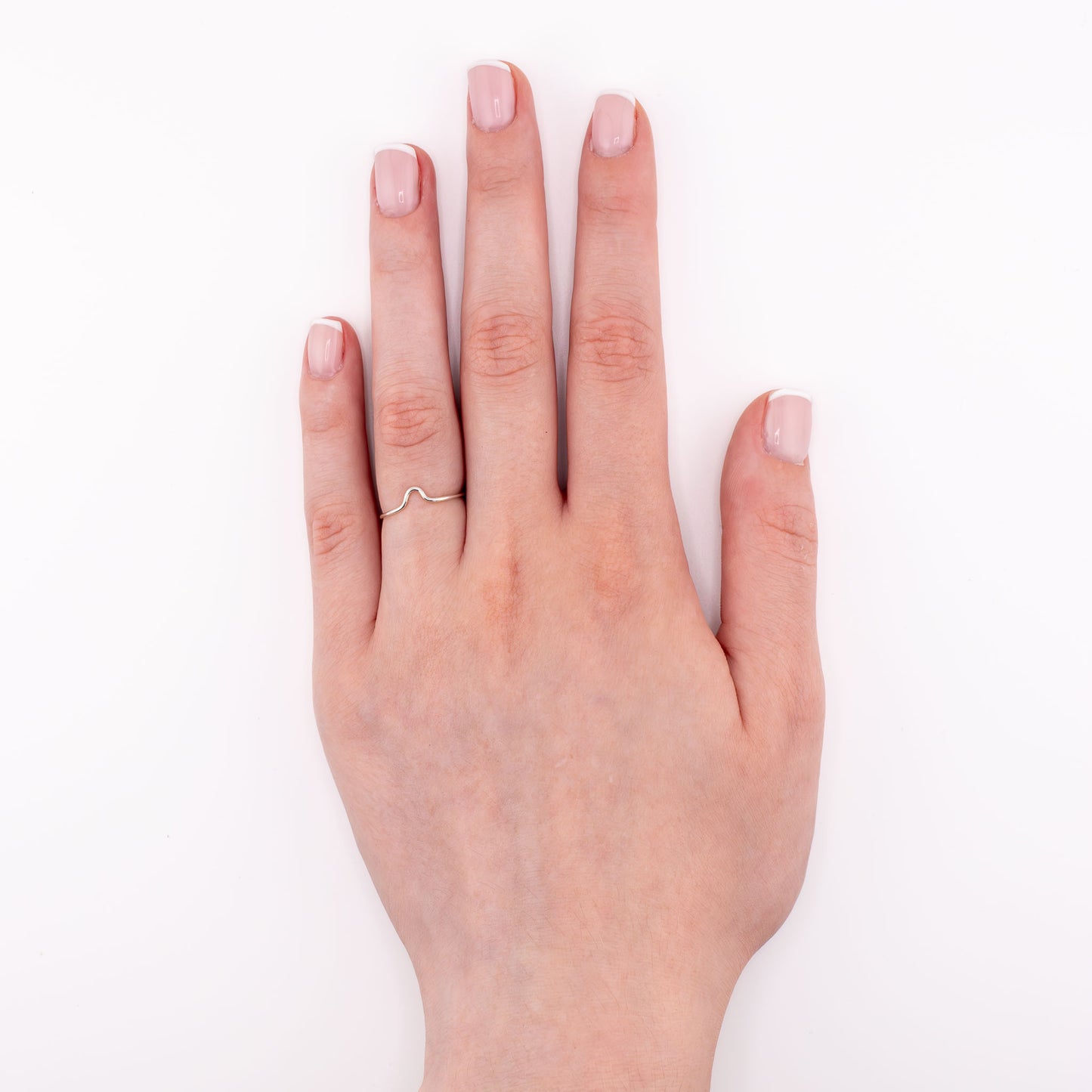 Sterling silver Tiny Cup Ring on hand model – midi or pinky stacking ring
