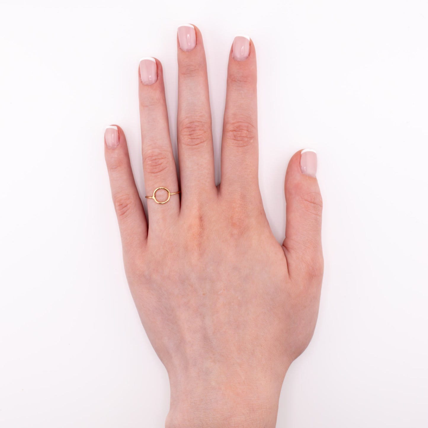 Gold tiny moon ring on model hand, new moon stacking ring astrology jewelry
