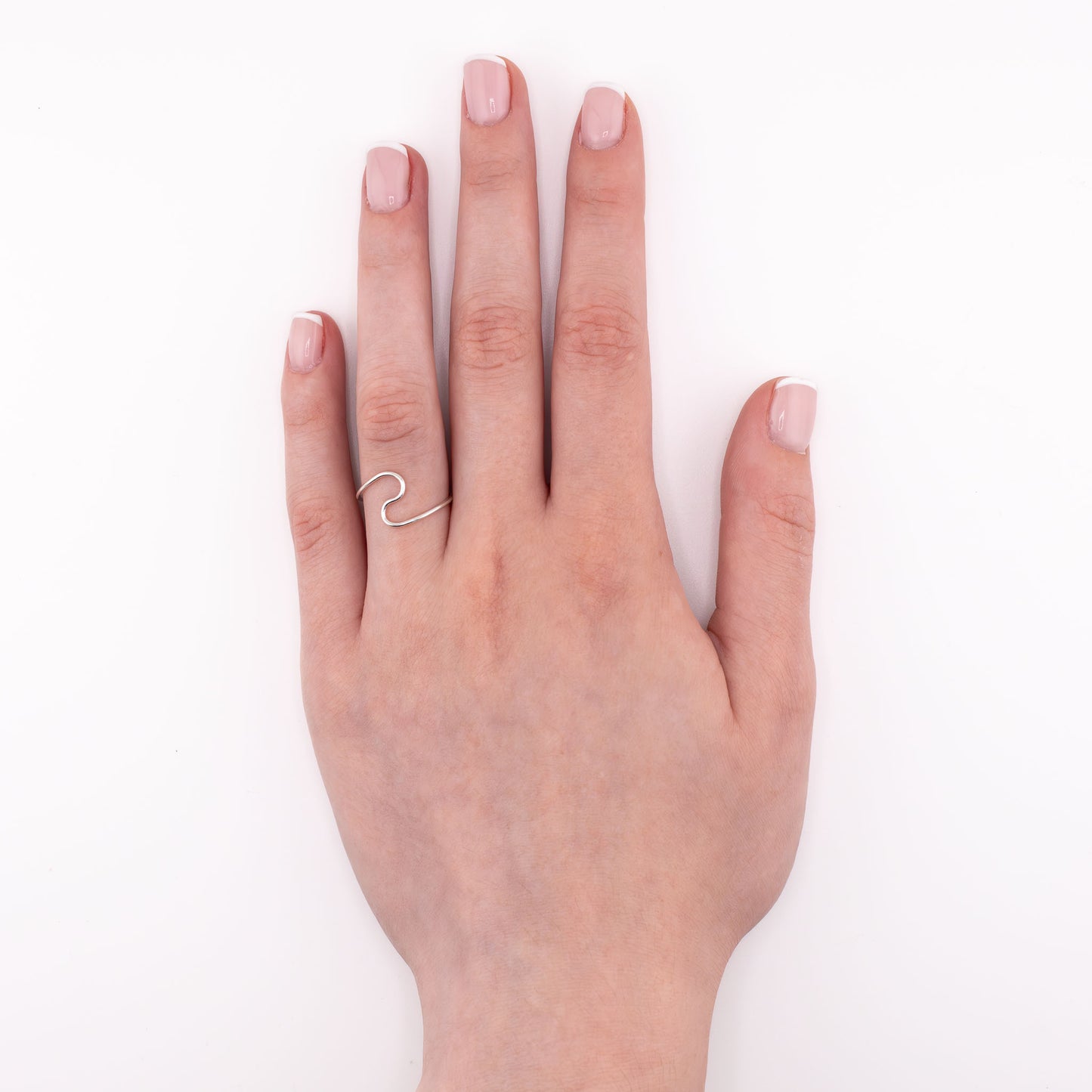 Sterling silver Wave stacking ring worn on hand, handmade ocean-inspired minimalist jewelry for everyday wear