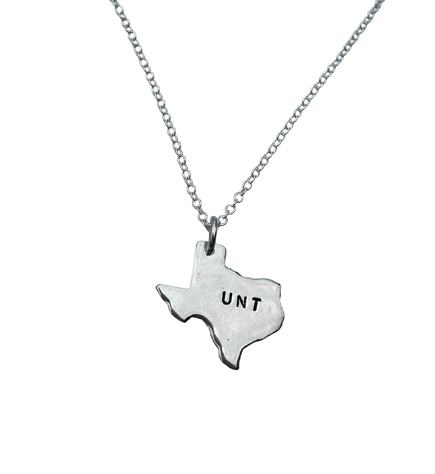 Silver necklace with a Texas-shaped pendant displaying 'UNT' on a white background
