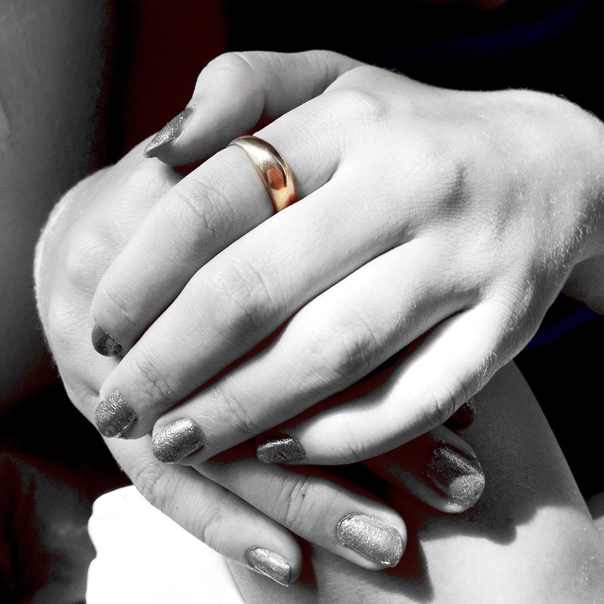 Artisan cast bronze dome ring styled on hand in natural light