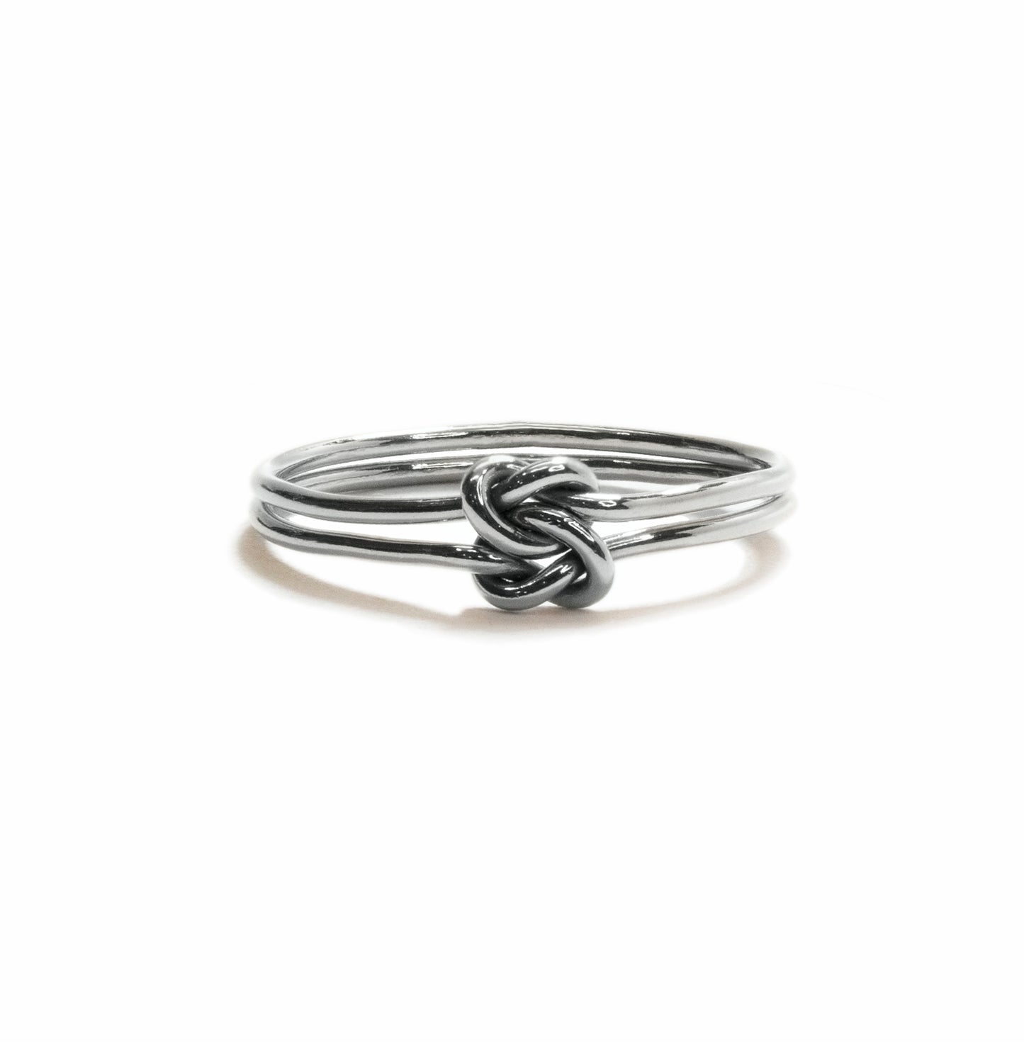 Love Knot stacking ring in sterling silver, handmade symbolic knot design for everyday wear