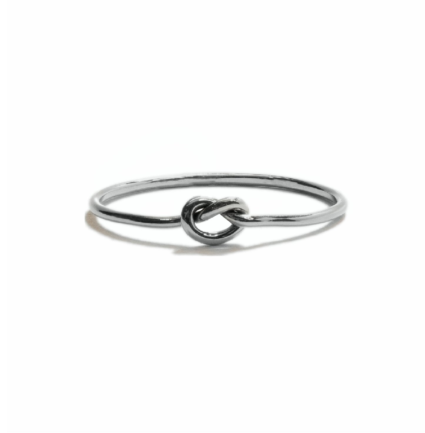 Tiny Knot stacking ring in sterling silver, simple minimalist handmade knot design for everyday wear