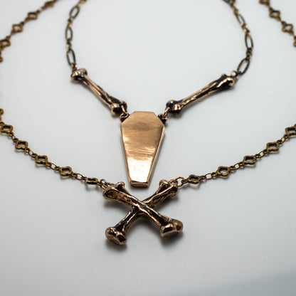 CROSSBONE IN BRONZE