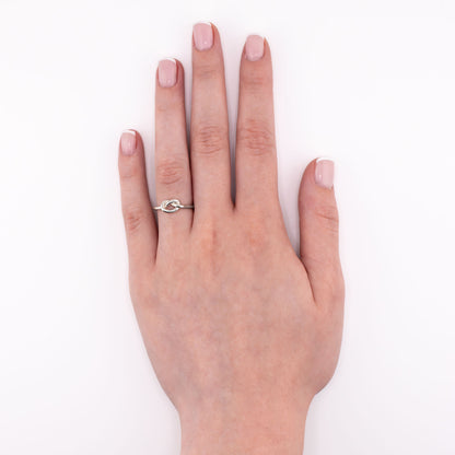Sterling silver Big Knot stacking ring shown on hand at an overview angle, durable bold knot jewelry for everyday wear