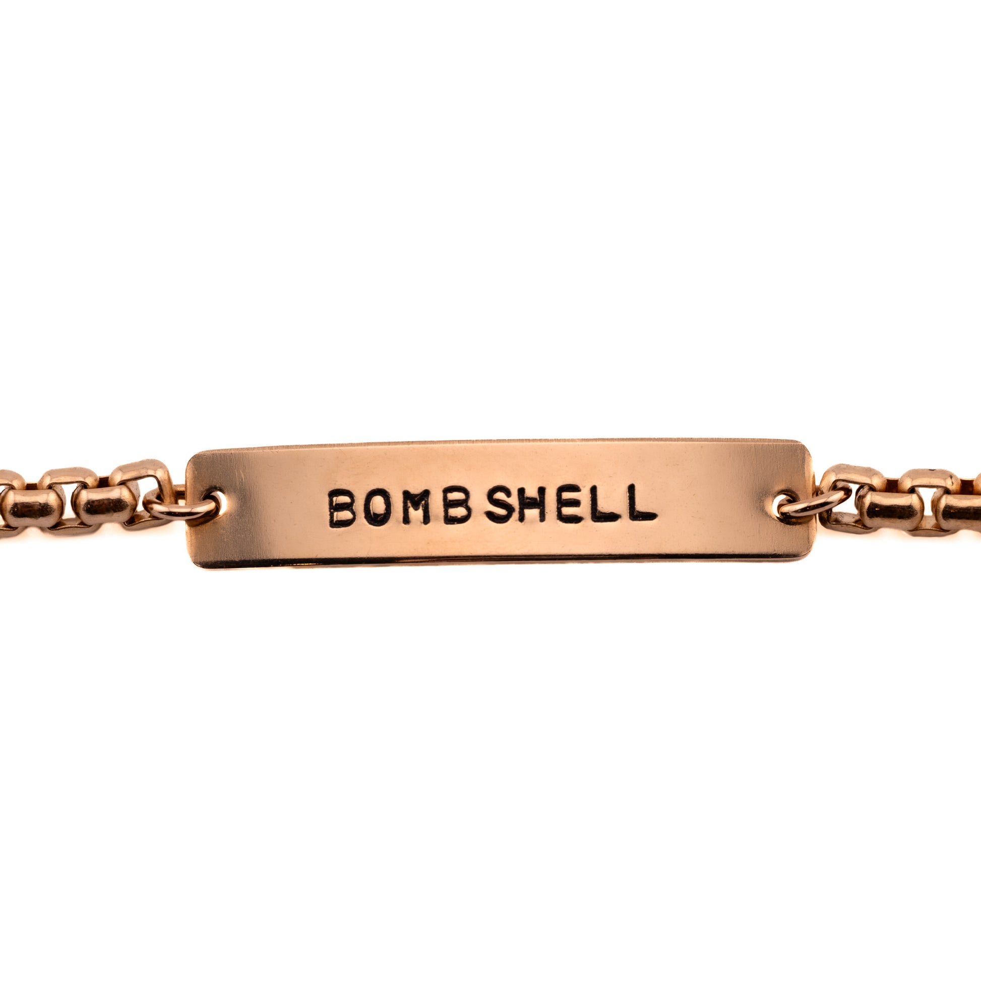Bombshell hand-stamped bronze bracelet on white background, fun gifts for women
