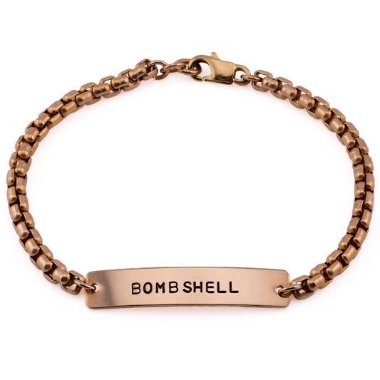 Hand-stamped bronze bracelet with Bombshell design, handmade in Austin Texas