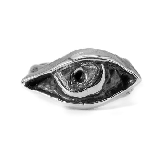 Close-up of cast silver Evil Eye ring showing textured artisan craftsmanship