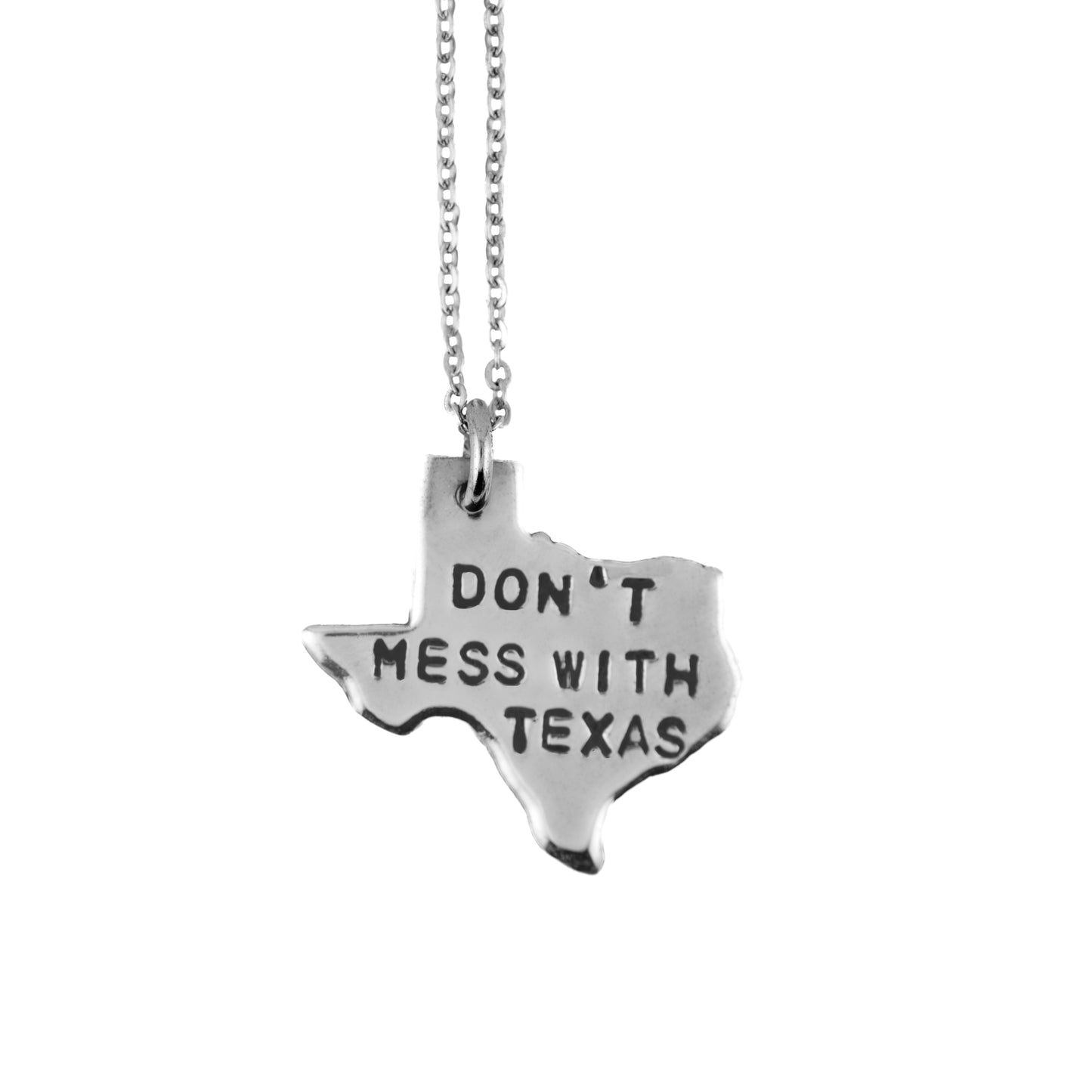 Silver necklace with a Texas-shaped pendant shows 'Don't mess with texas' on a white background