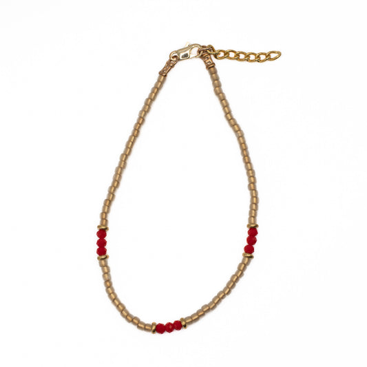 Handmade Japanese seed bead anklet in tan gold with bold red accents, made in Texas USA.