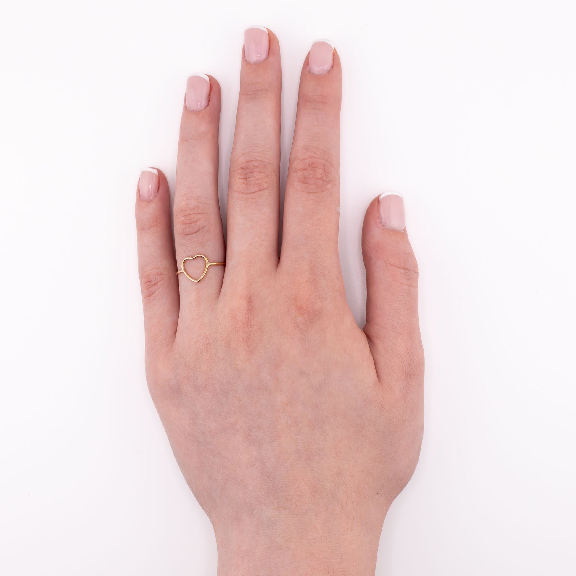 14k gold-filled Heart stacking ring on hand model, minimalist handmade love jewelry for stacking or solo wear