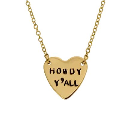 Gold heart-shaped necklace with 'HOWDY Y'ALL' engraving on a white background