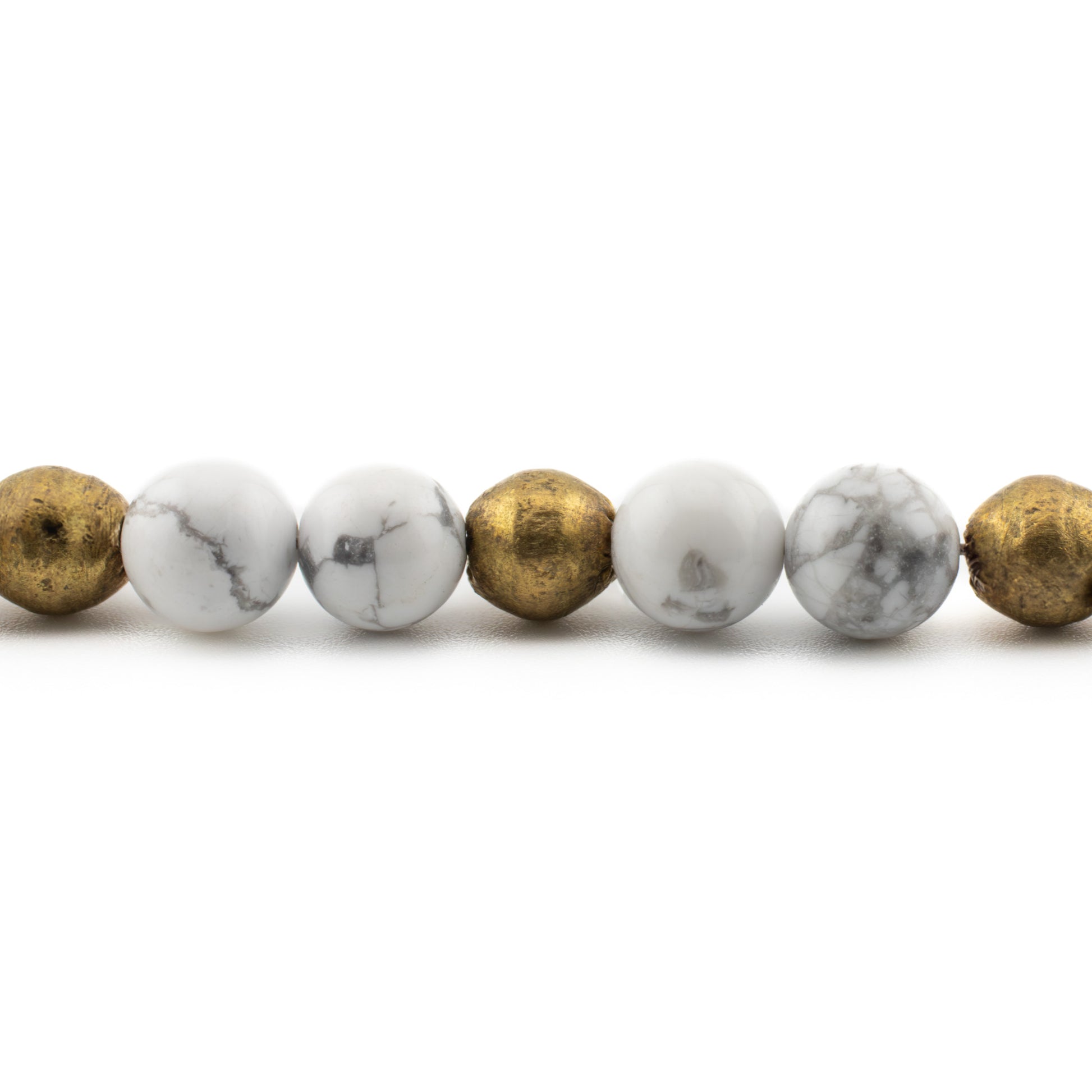 Close-up of polished Howlite beads with gray veining, stress relief and meditation bracelet handmade in Austin.