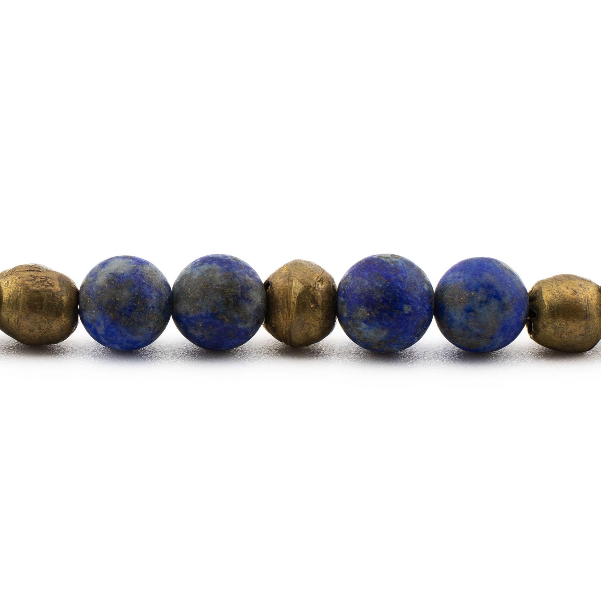 Close-up of deep blue lapis lazuli beads with natural gold flecks, meditation bracelet handmade in Austin.