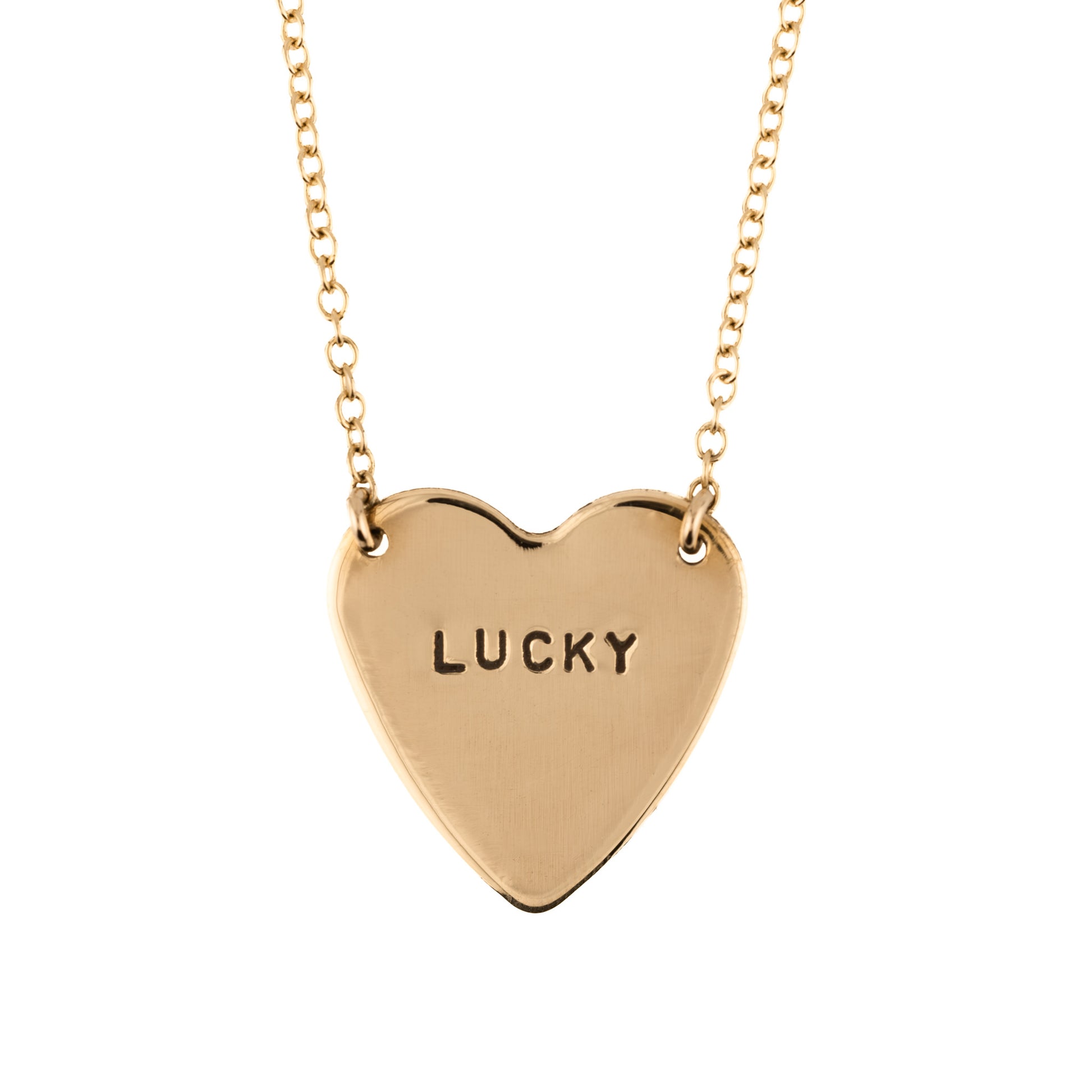 Gold heart-shaped necklace with 'LUCKY' engraving on a white background