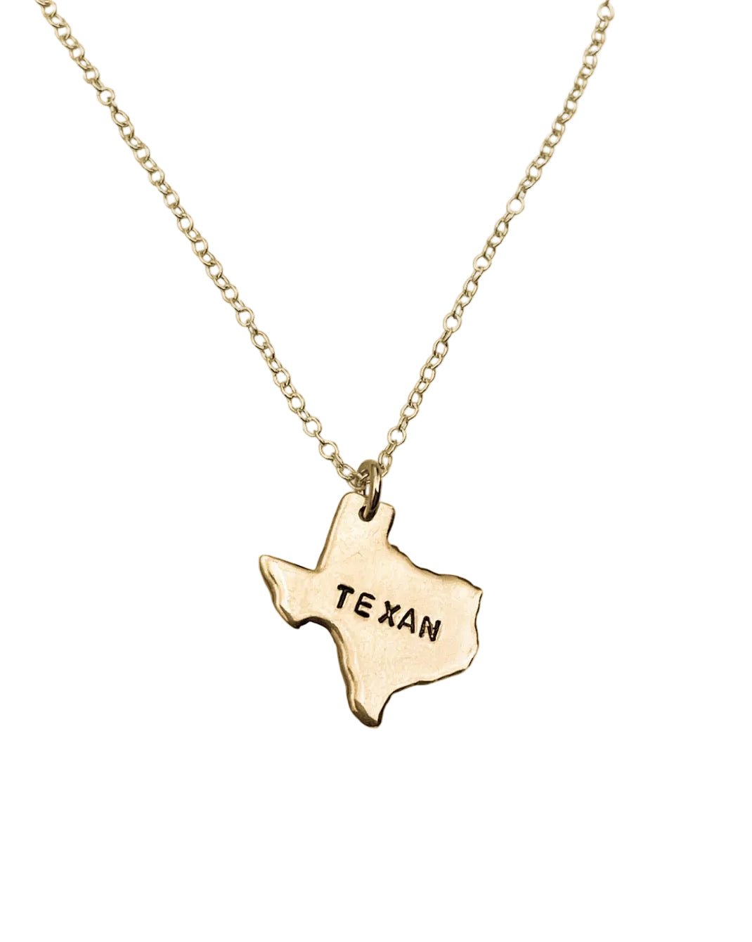 Gold necklace with a Texas-shaped pendant on a white background