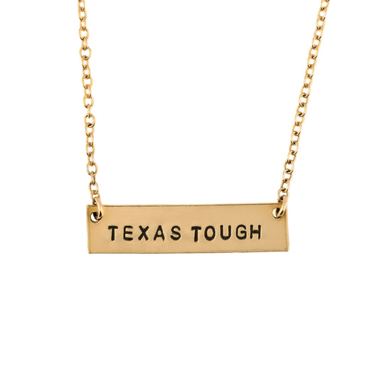 Gold necklace with 'TEXAS TOUGH' pendant on a white background