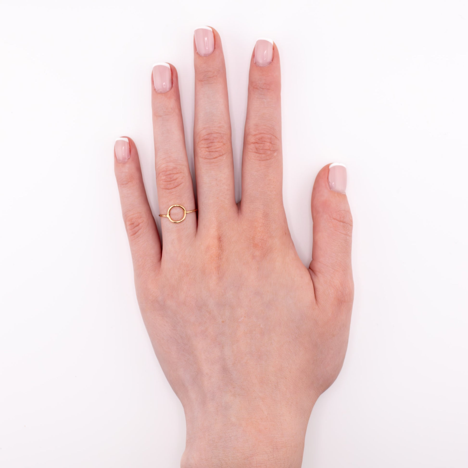Gold tiny moon ring on model hand, new moon stacking ring astrology jewelry