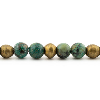 Close-up of polished turquoise beads with natural veining, protective meditation bracelet handmade in Austin.