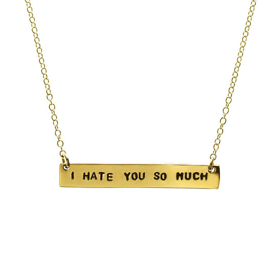 A gold-filled chain necklace with the text 'I HATE YOU SO MUCH' stamped in capital letters.
