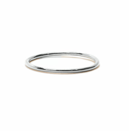 Tiny band sterling silver stacking ring handmade on a white background front