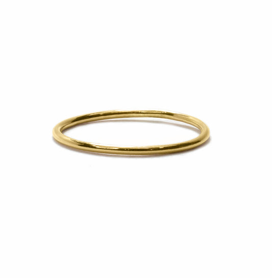 Tiny band 14k gold filled stacking ring on a white background front