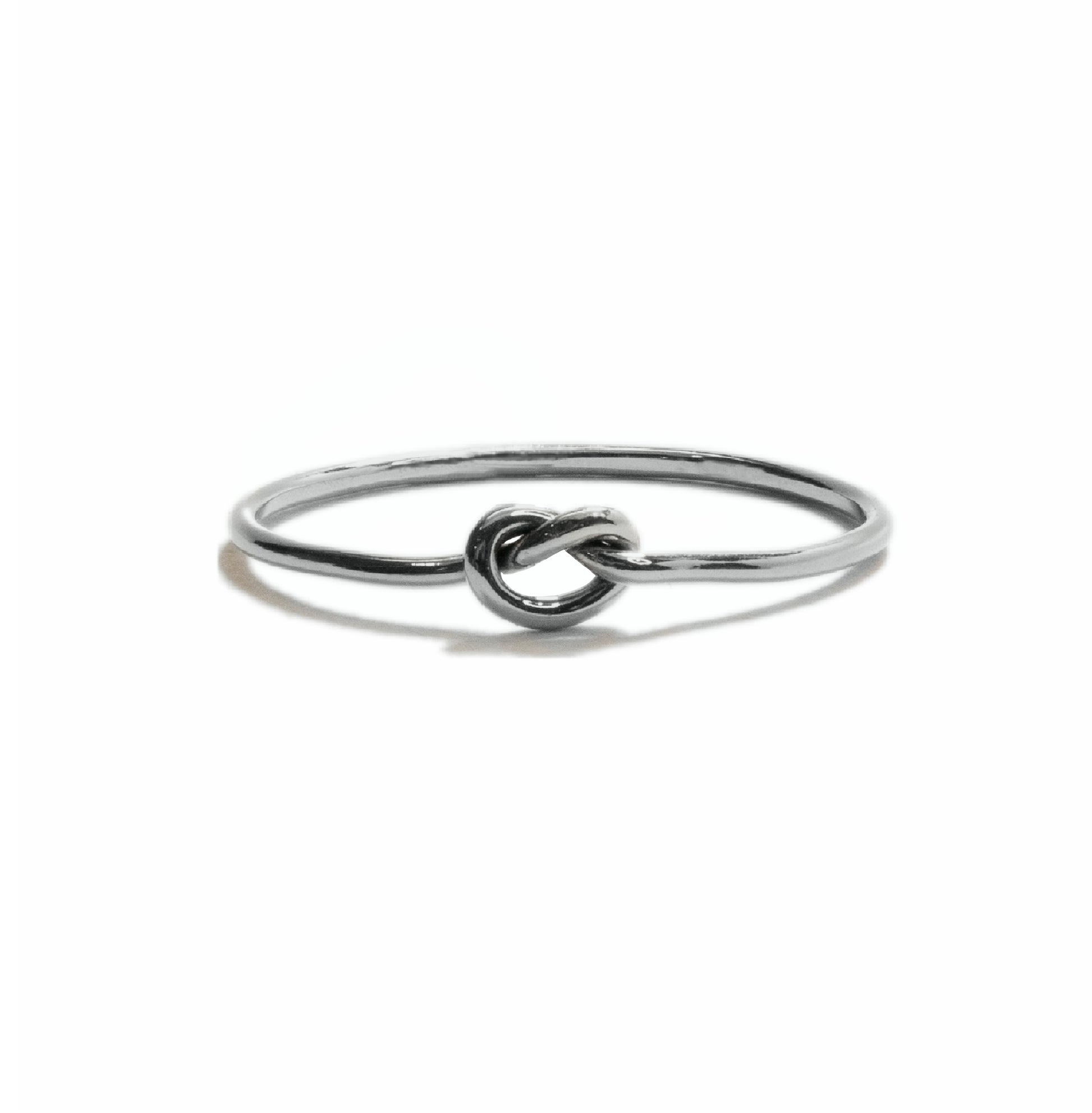 Tiny Knot stacking ring in sterling silver, simple minimalist handmade knot design for everyday wear